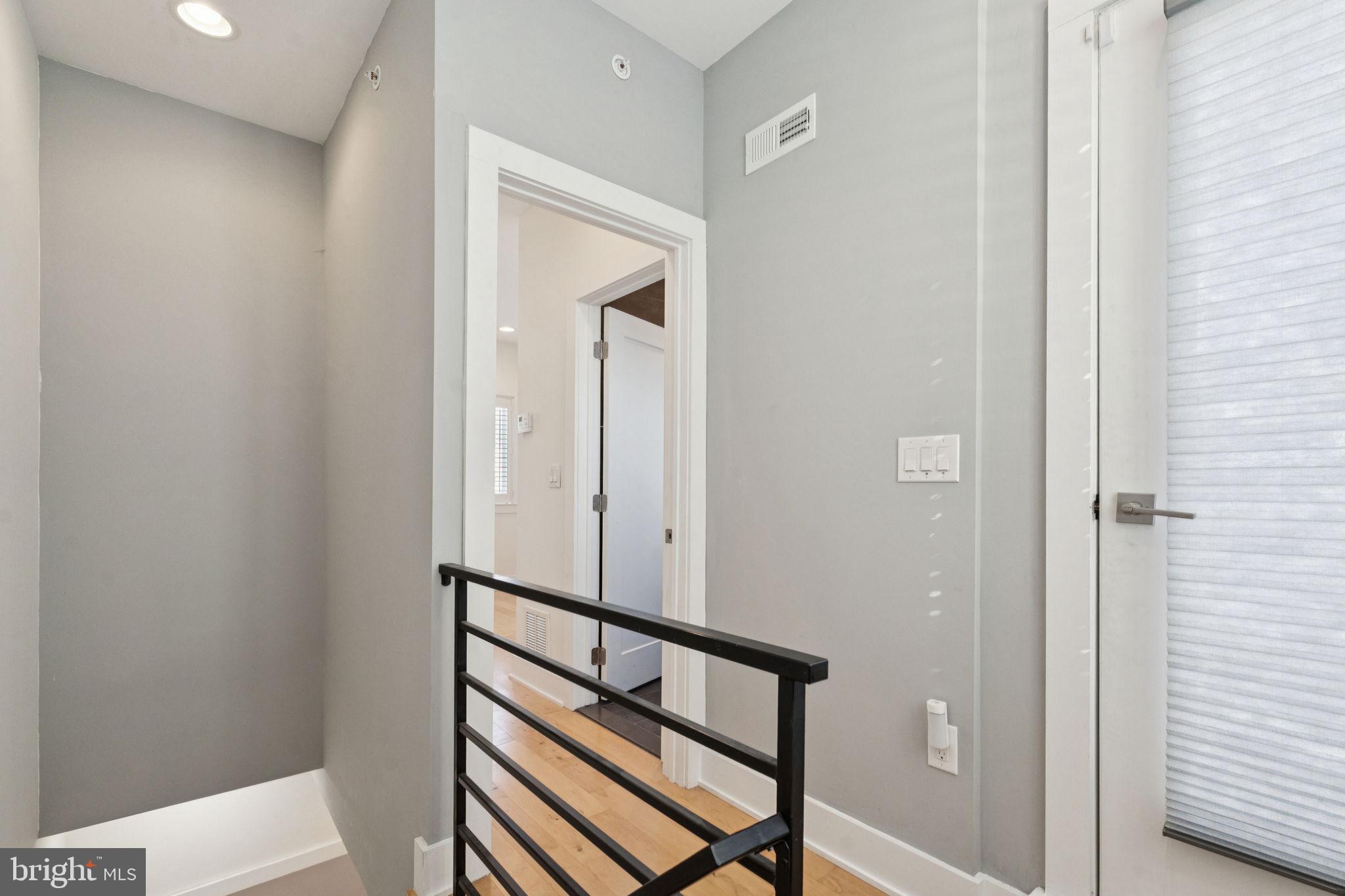 1825 Gerritt Street Philadelphia, PA 19146 - Photo 19 of 34 a view of a hallway with wooden floor and stairs