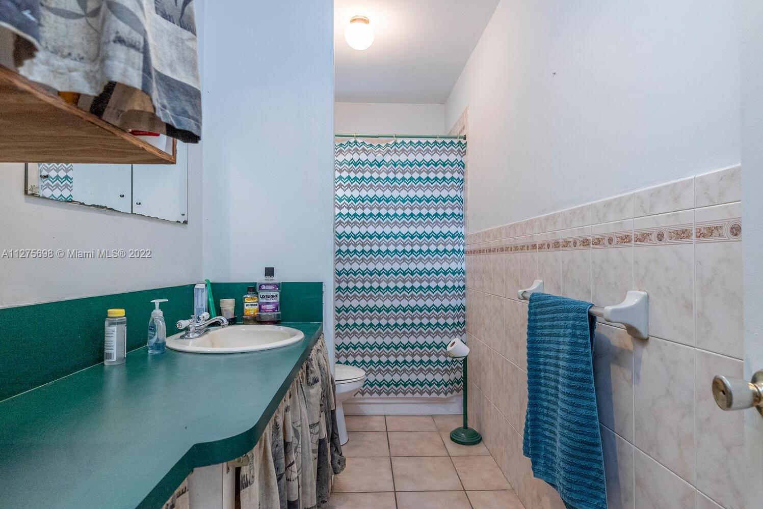 15140 Southwest 296th Street Homestead, FL 33033 - Photo 13 of 13 a bathroom with a sink and mirror