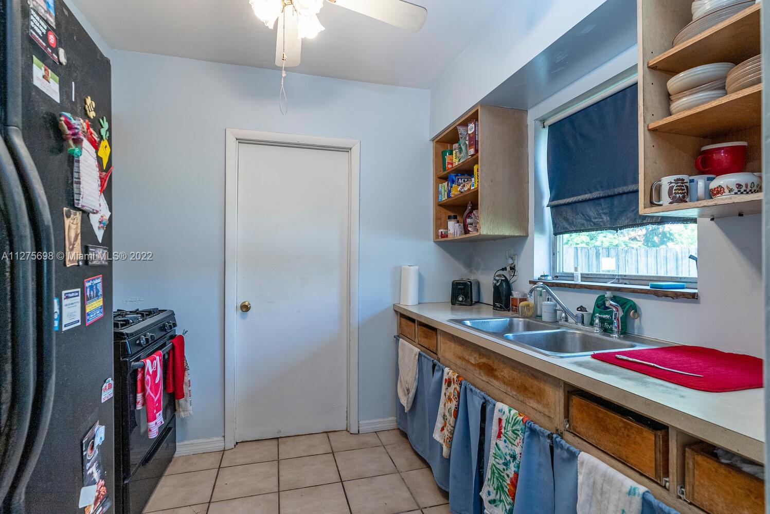 15140 Southwest 296th Street Homestead, FL 33033 - Photo 8 of 13 a room with storage and utility