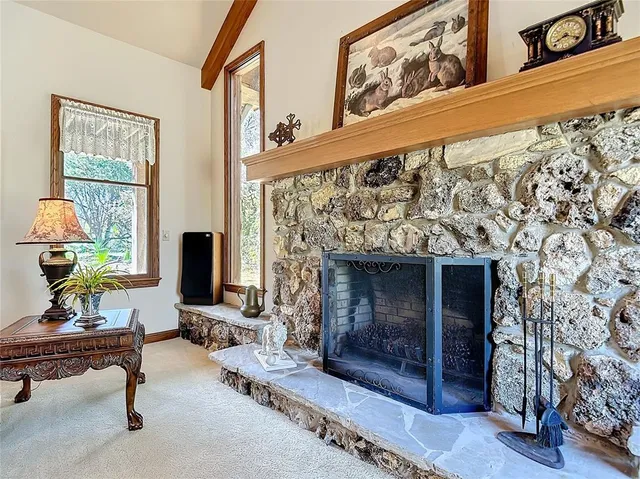 a living room with furniture a piano and a window
