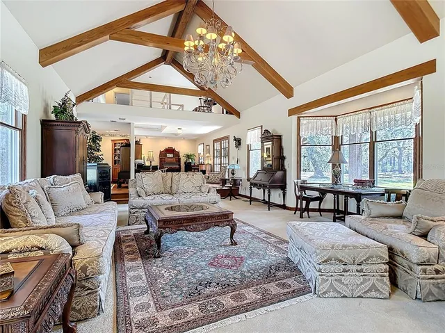 a bedroom with furniture and a window