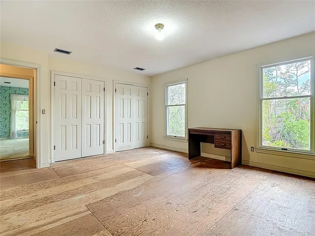 a view of a pathway with a garden