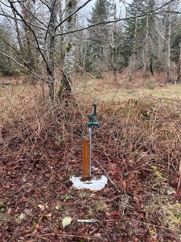 a fire hydrant in middle of the field