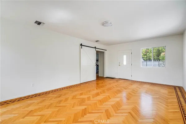 a view of an empty room with a window