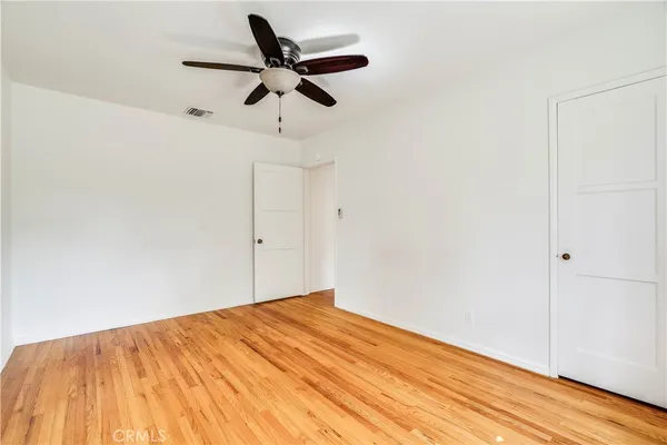 a view of a room with a wooden floor