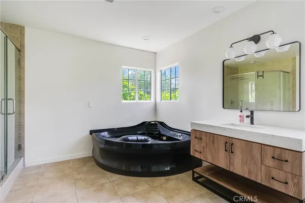 a room with a sink and a mirror
