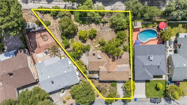 an aerial view of residential house with outdoor space and mountain view