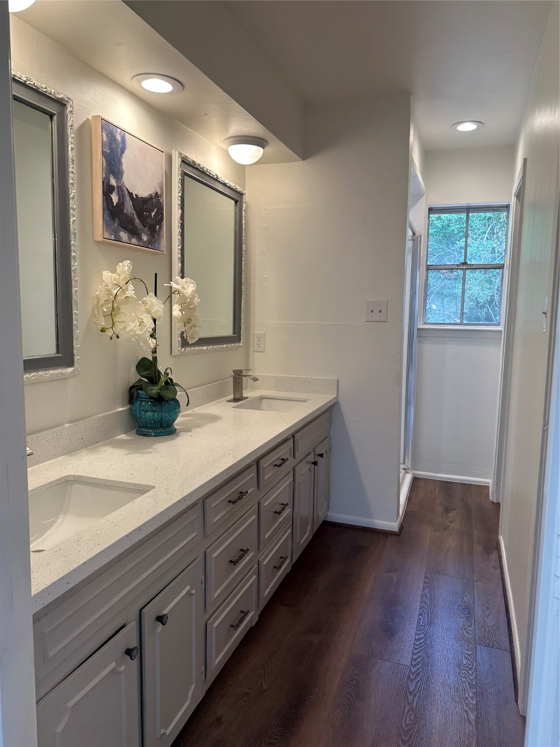 235 Beech Road Conroe, TX 77304 - Photo 5 of 6 a spacious bathroom with a double vanity sink and a mirror