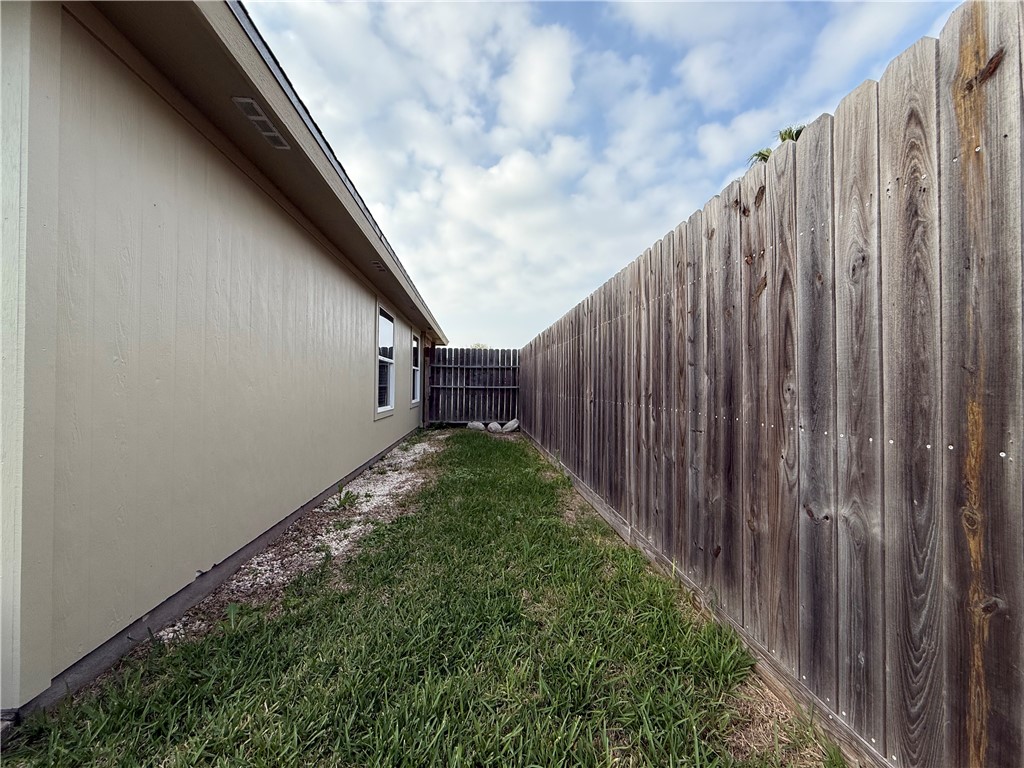 1207 Sacramento Street Portland, TX 78374 - Photo 18 of 22 a view of a pathway of a wooden fence