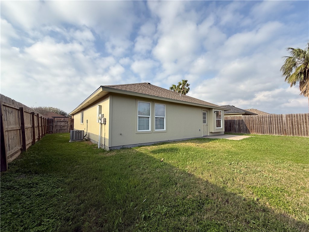 1207 Sacramento Street Portland, TX 78374 - Photo 19 of 22 a backyard of a house with lots of green space
