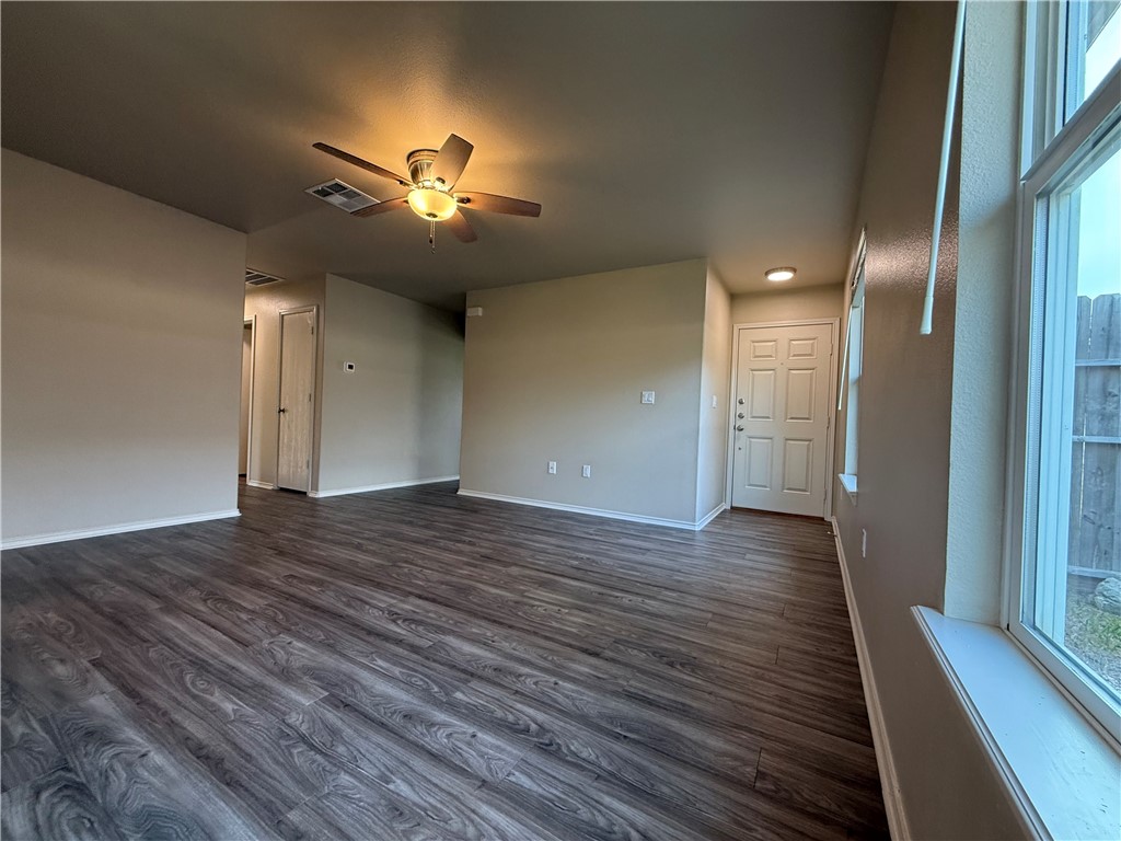 1207 Sacramento Street Portland, TX 78374 - Photo 4 of 22 a view of empty room with wooden floor