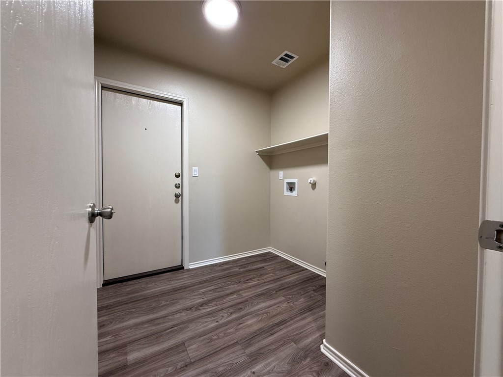 1207 Sacramento Street Portland, TX 78374 - Photo 6 of 22 a view of a hallway with wooden floor
