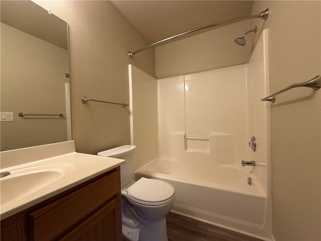 1207 Sacramento Street Portland, TX 78374 - Photo 9 of 22 a bathroom with a sink a toilet and shower