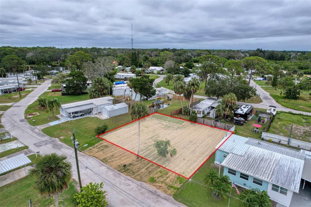 6836 Edgewater Drive New Port Richey, FL 34652 - Photo 16 of 19 an aerial view of a house with a garden and lake view