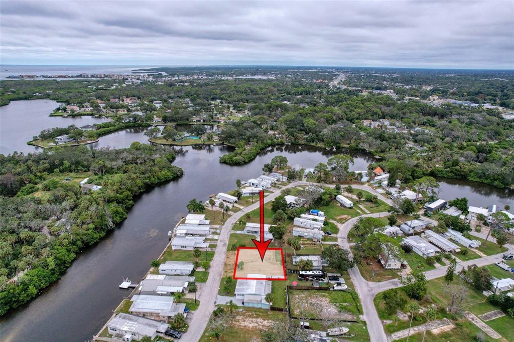 6836 Edgewater Drive New Port Richey, FL 34652 - Photo 2 of 19 an aerial view of residential houses with outdoor space