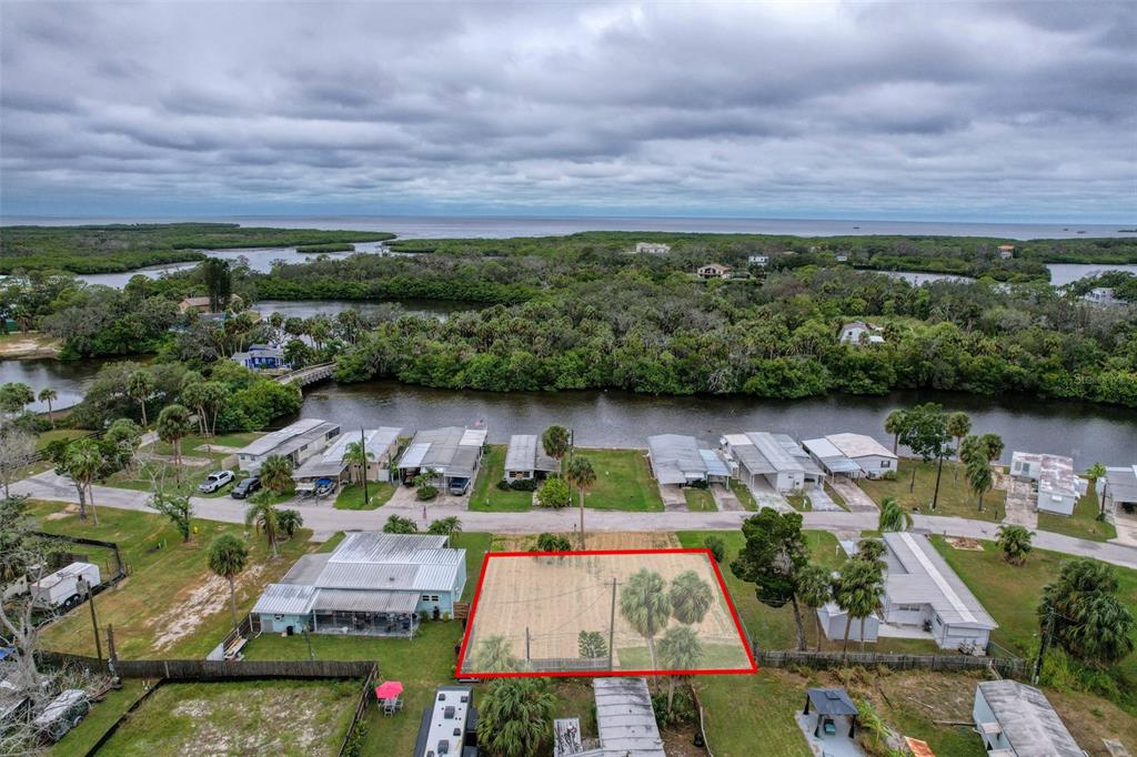 6836 Edgewater Drive New Port Richey, FL 34652 - Photo 5 of 19 an aerial view of house with yard swimming pool and outdoor seating