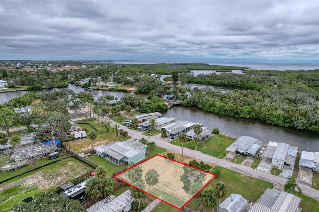 6836 Edgewater Drive New Port Richey, FL 34652 - Photo 6 of 19 an aerial view of a house with a garden