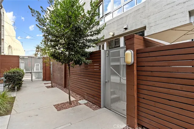 a view of a house with a tree
