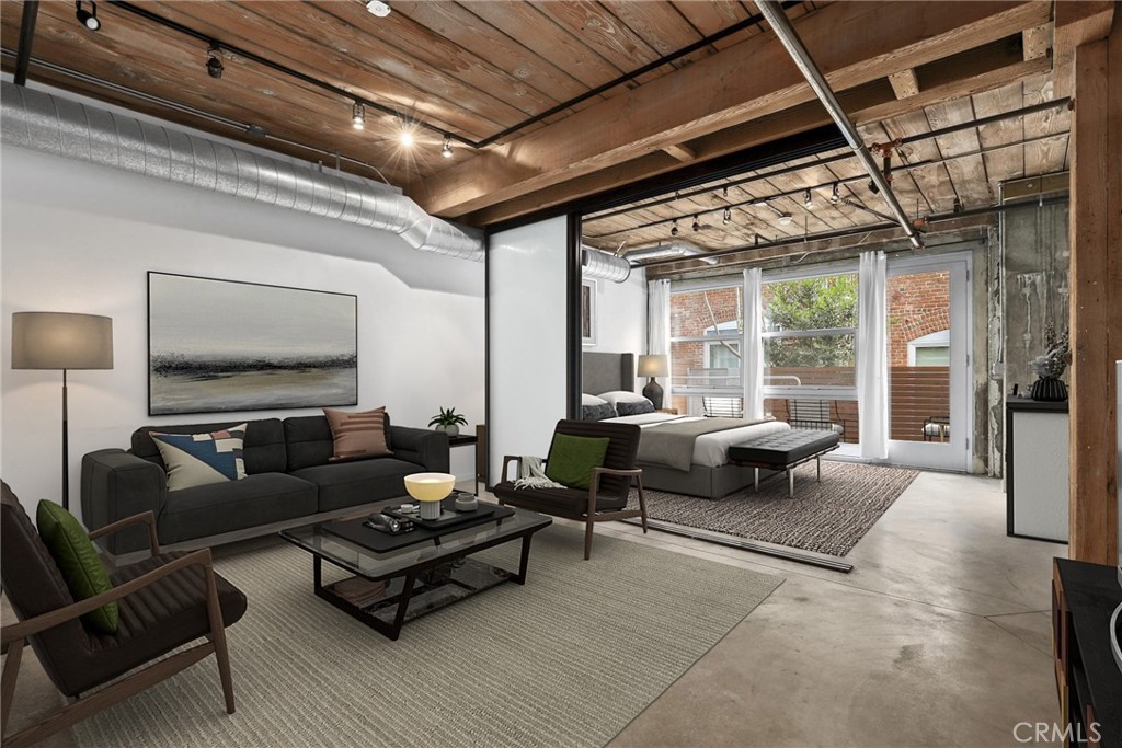 530 South Hewitt Street, Unit 154 Los Angeles, CA 90013 - Photo 2 of 32 a living room with furniture and a flat screen tv