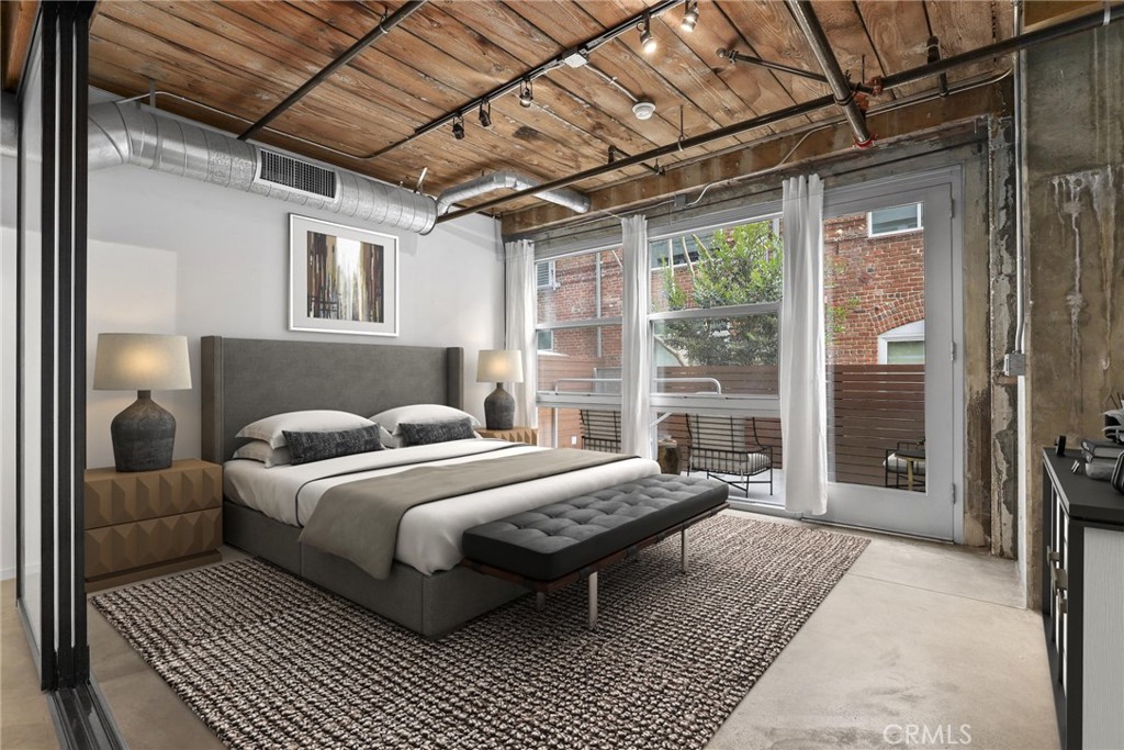 530 South Hewitt Street, Unit 154 Los Angeles, CA 90013 - Photo 4 of 32 a bedroom with a bed wooden floor and next to a window