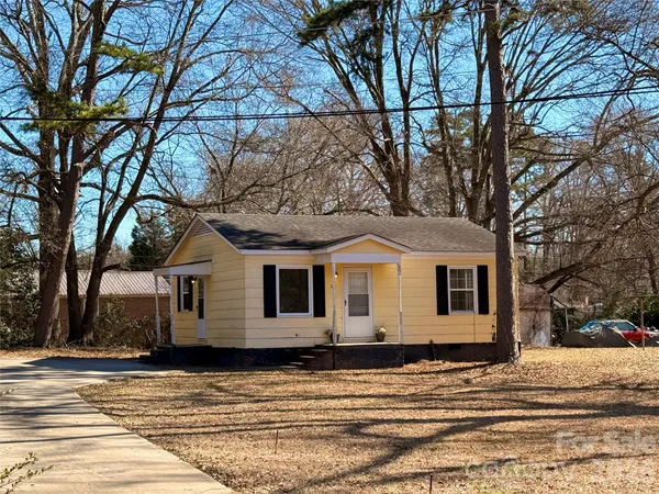 a view of a house with a snow in the background