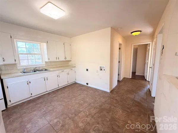 a view of a kitchen with a sink