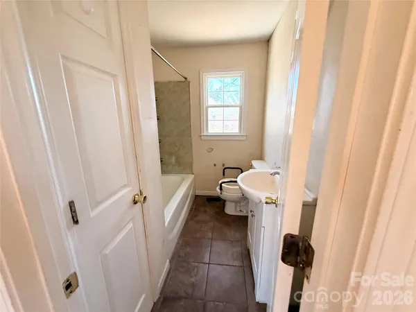 a bathroom with a sink and toilet
