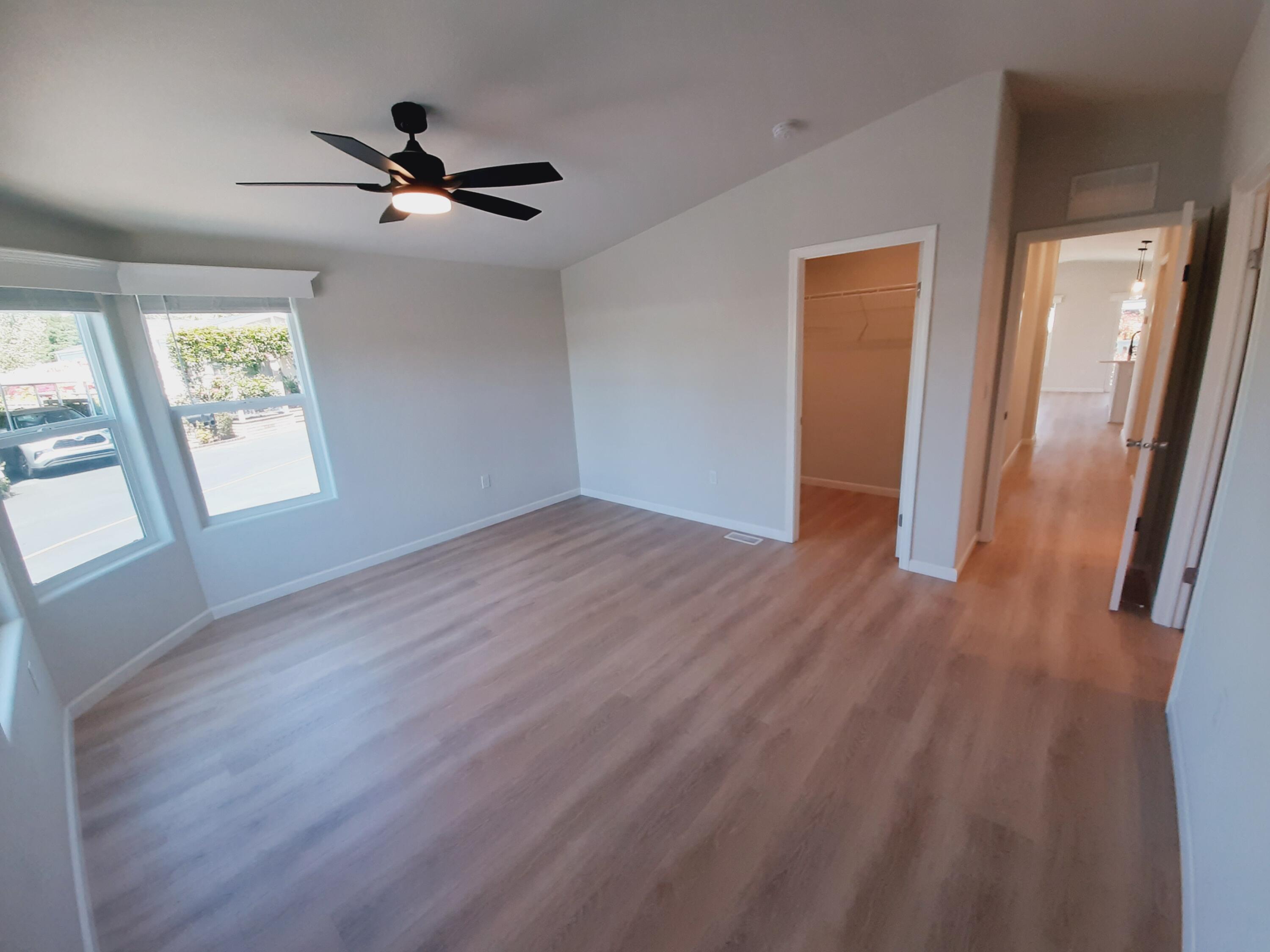 333 Old Mill Road, Unit 52 Santa Barbara, CA 93110 - Photo 16 of 29 a view of empty room with wooden floor and fan