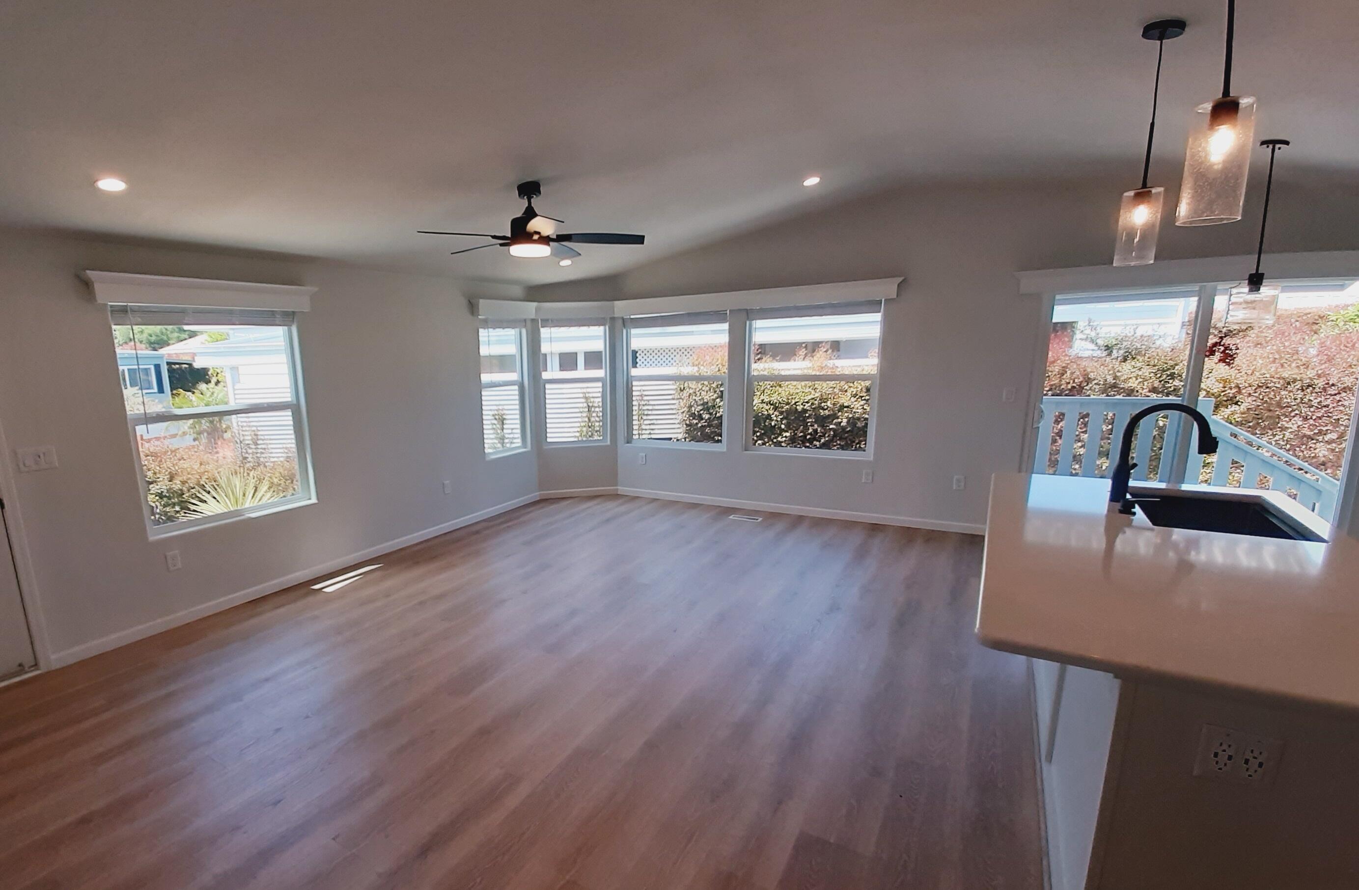 333 Old Mill Road, Unit 52 Santa Barbara, CA 93110 - Photo 8 of 29 a view of an empty room with window and wooden floor