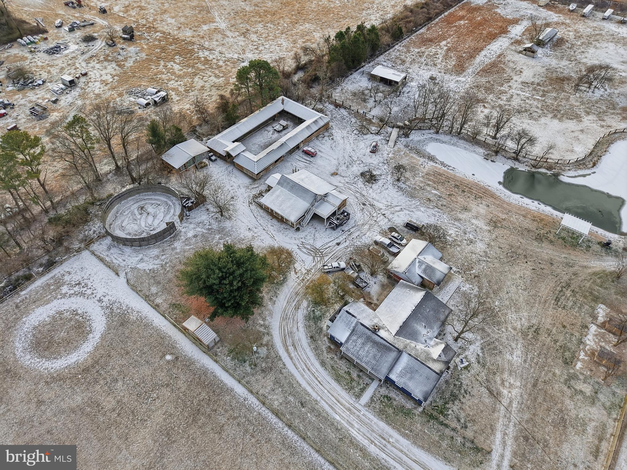 20915 Dover Bridge Road Preston, MD 21655 - Photo 17 of 60 an aerial view of a house with garden space and parking