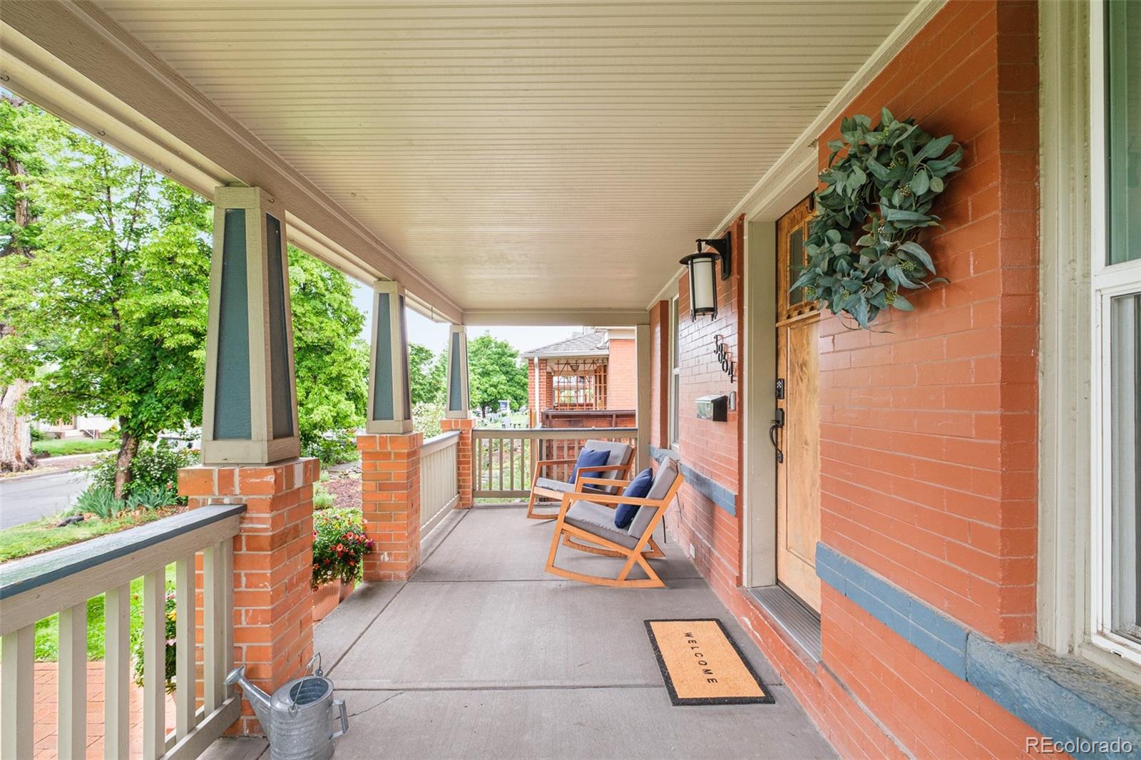 a view of a two chairs in the balcony