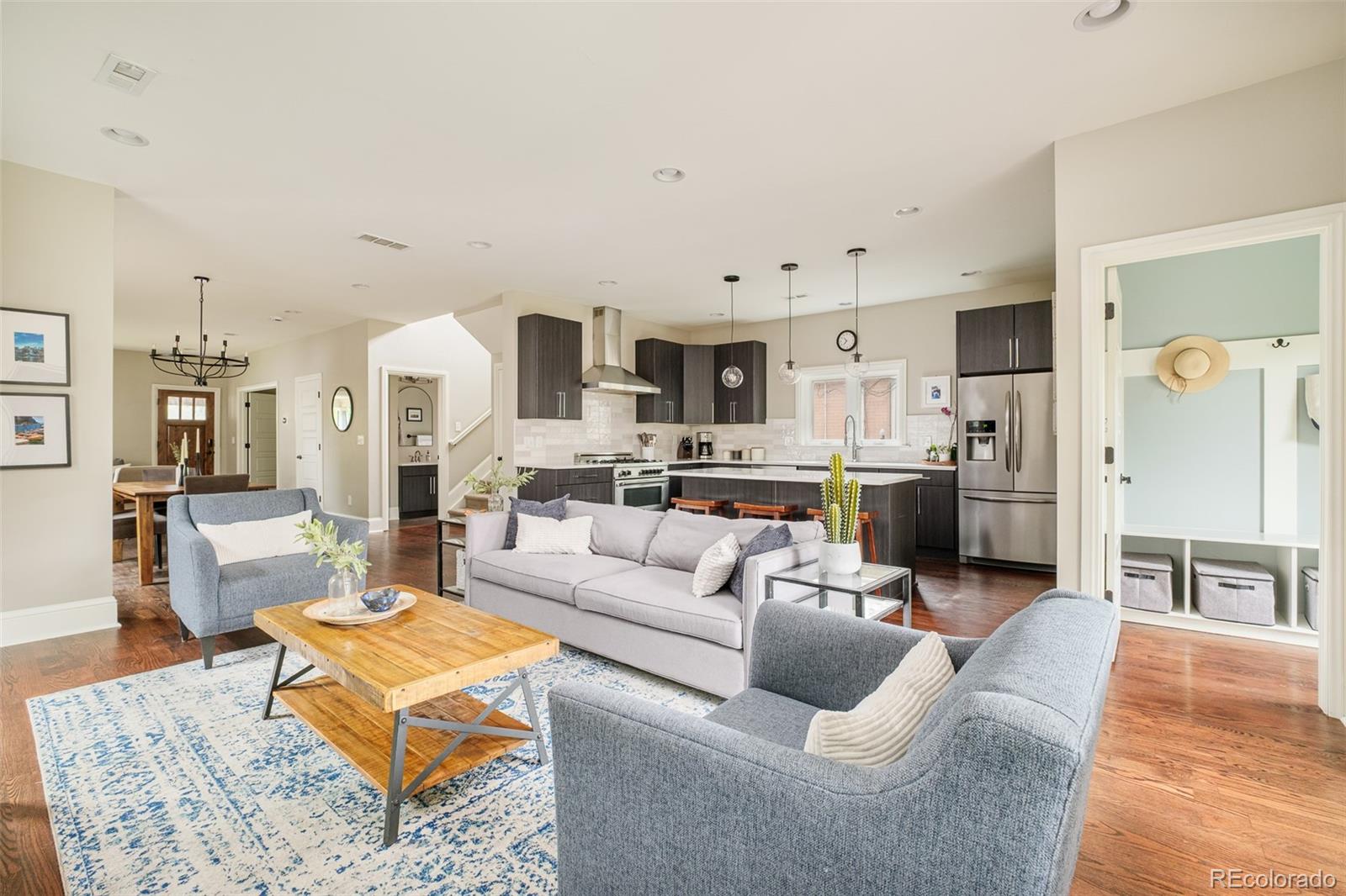 3864 Osceola Street Denver, CO 80212 - Photo 12 of 43 a living room with furniture and kitchen view