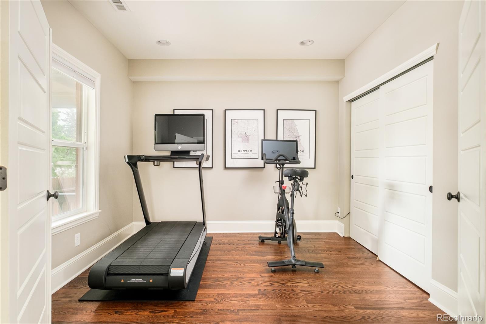 3864 Osceola Street Denver, CO 80212 - Photo 15 of 43 a living room with furniture and a flat screen tv