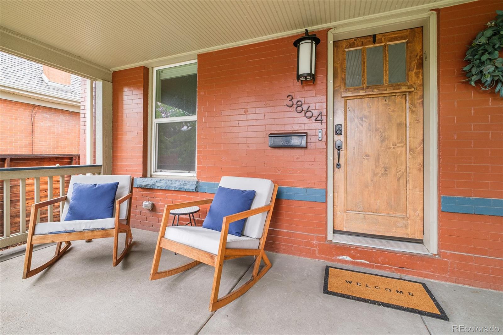 3864 Osceola Street Denver, CO 80212 - Photo 2 of 43 a living room with furniture and a window