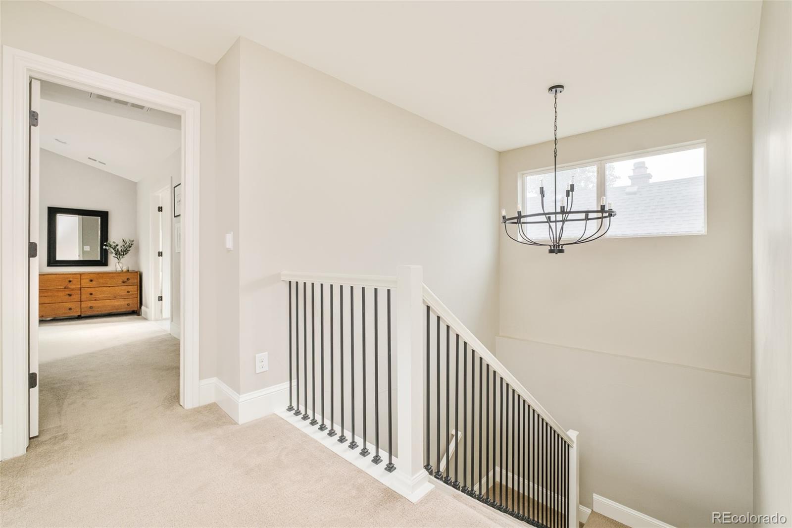 3864 Osceola Street Denver, CO 80212 - Photo 22 of 43 a view of a hallway view with staircase