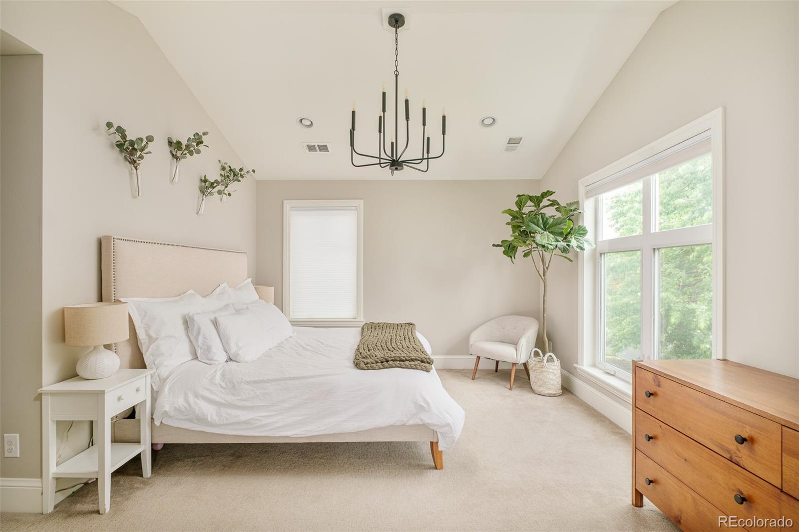 3864 Osceola Street Denver, CO 80212 - Photo 24 of 43 a bedroom with a bed and window