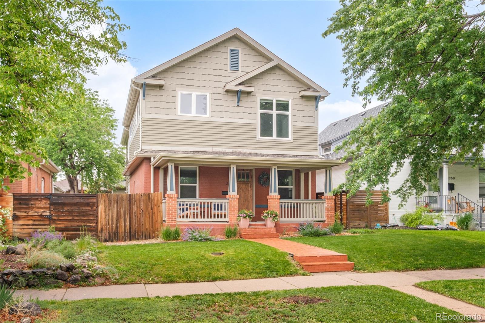 3864 Osceola Street Denver, CO 80212 - Photo 3 of 43 a front view of a house with a yard