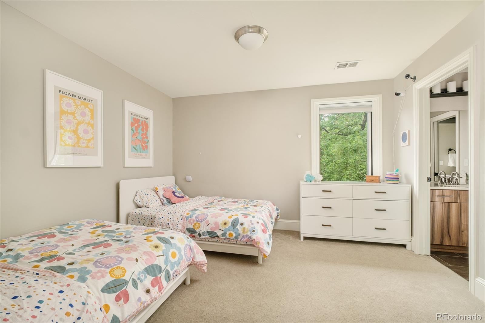 3864 Osceola Street Denver, CO 80212 - Photo 33 of 43 a bedroom with two bed and a window