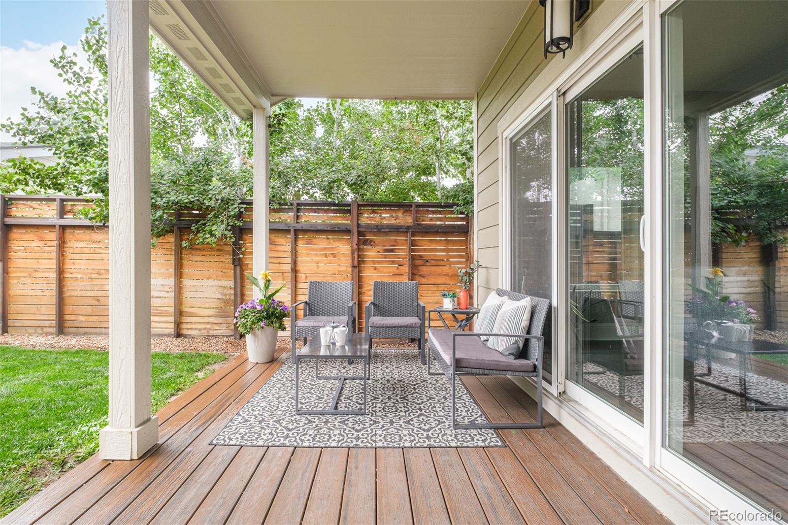 3864 Osceola Street Denver, CO 80212 - Photo 38 of 43 a living room with large windows and wooden floor