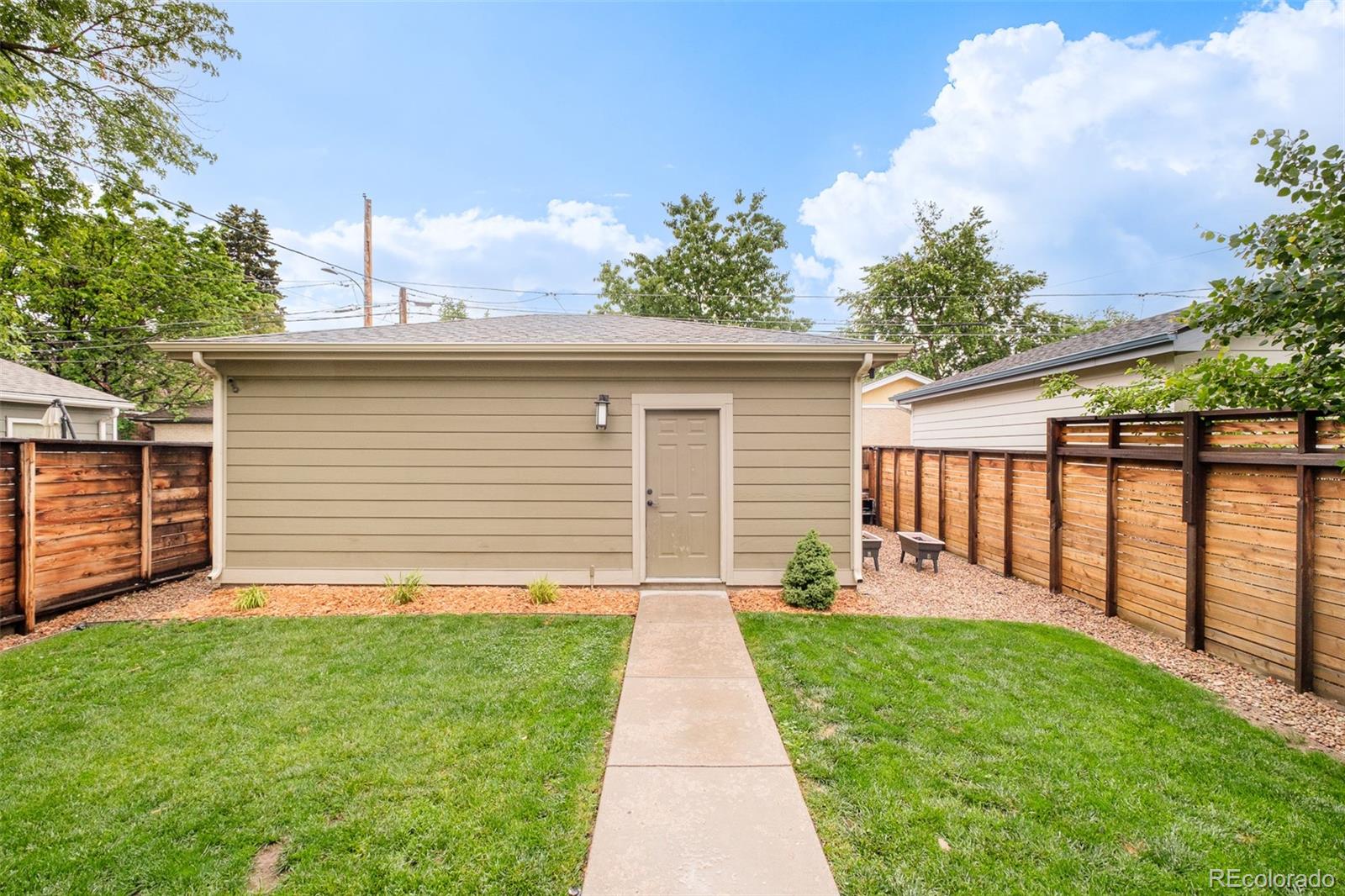 3864 Osceola Street Denver, CO 80212 - Photo 39 of 43 a front view of house with yard and green space
