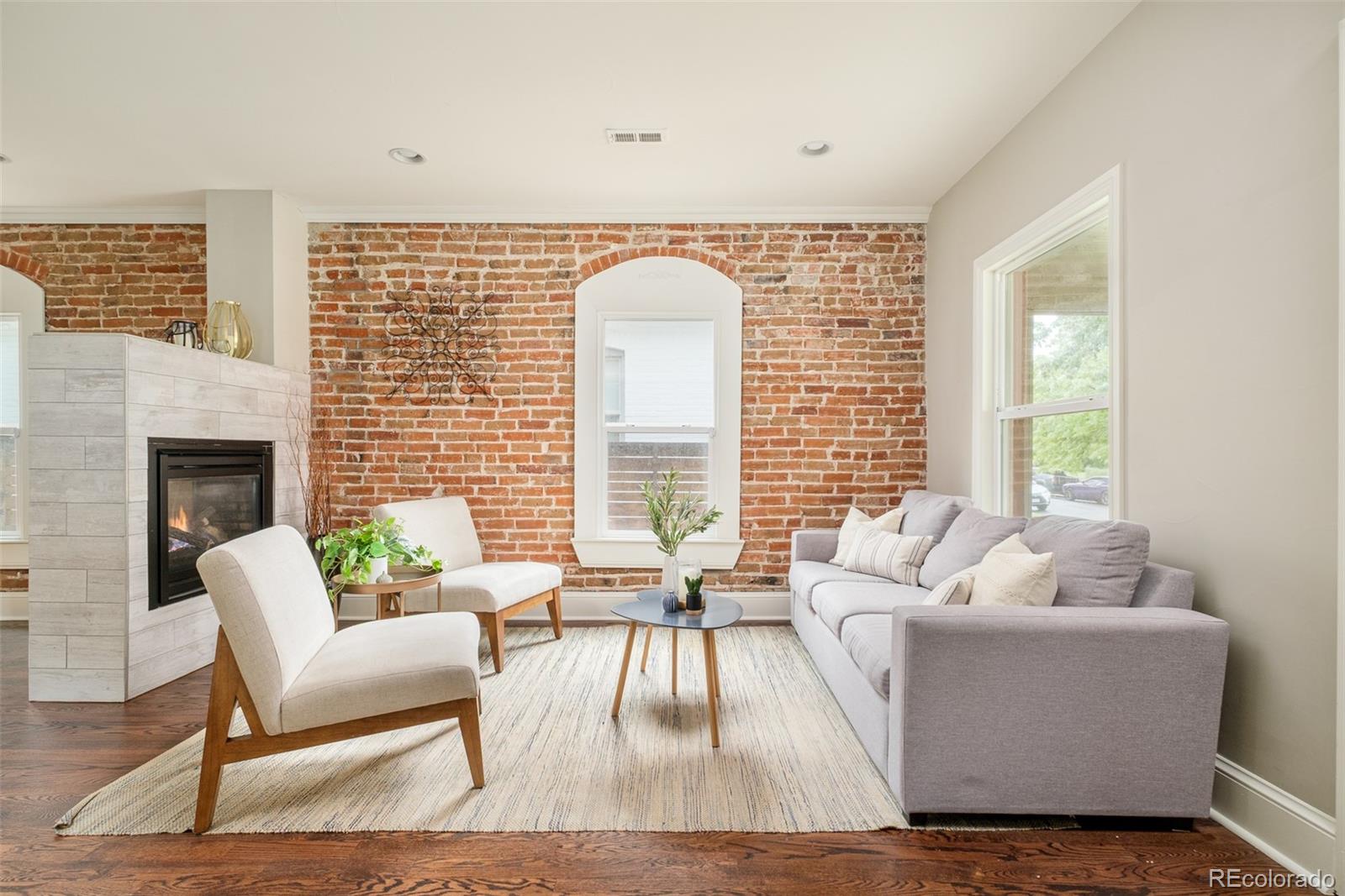 3864 Osceola Street Denver, CO 80212 - Photo 4 of 43 a living room with furniture and a large window