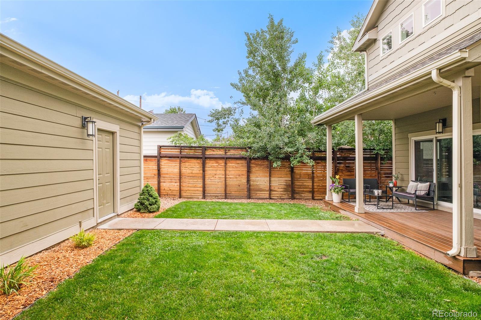 3864 Osceola Street Denver, CO 80212 - Photo 42 of 43 a view of a backyard with a garden and plants