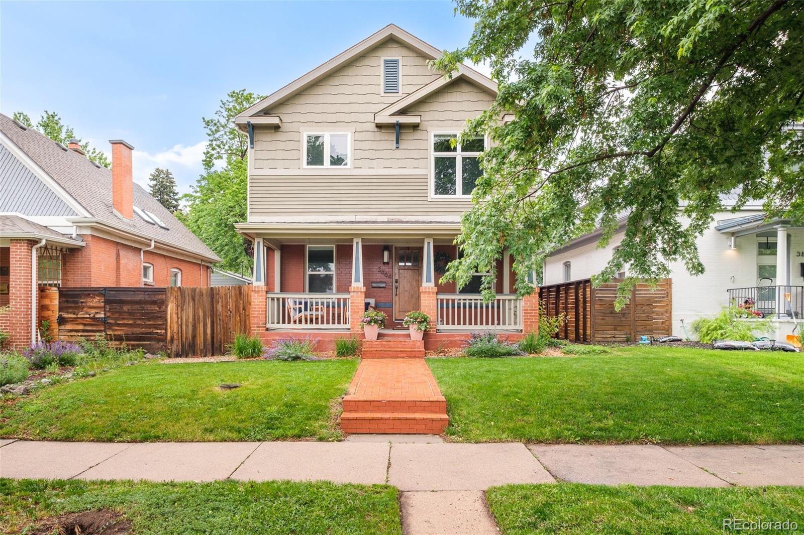 3864 Osceola Street Denver, CO 80212 - Photo 43 of 43 a front view of a house with a yard