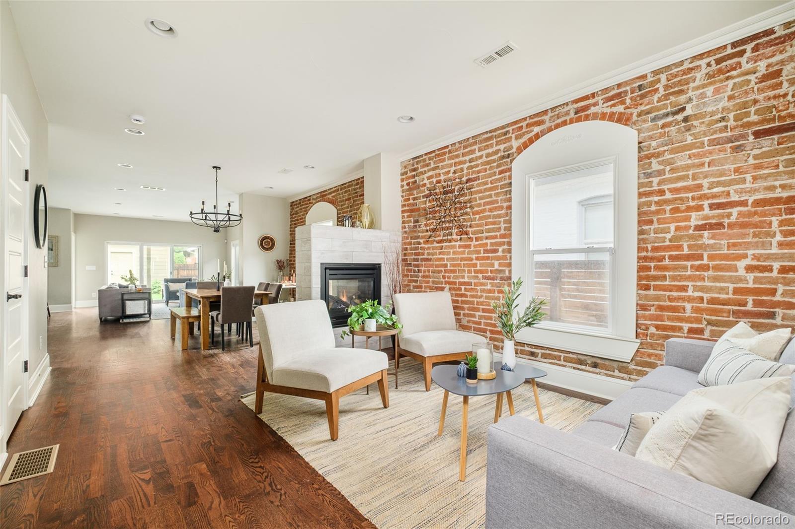 3864 Osceola Street Denver, CO 80212 - Photo 5 of 43 a living room with furniture and a fireplace