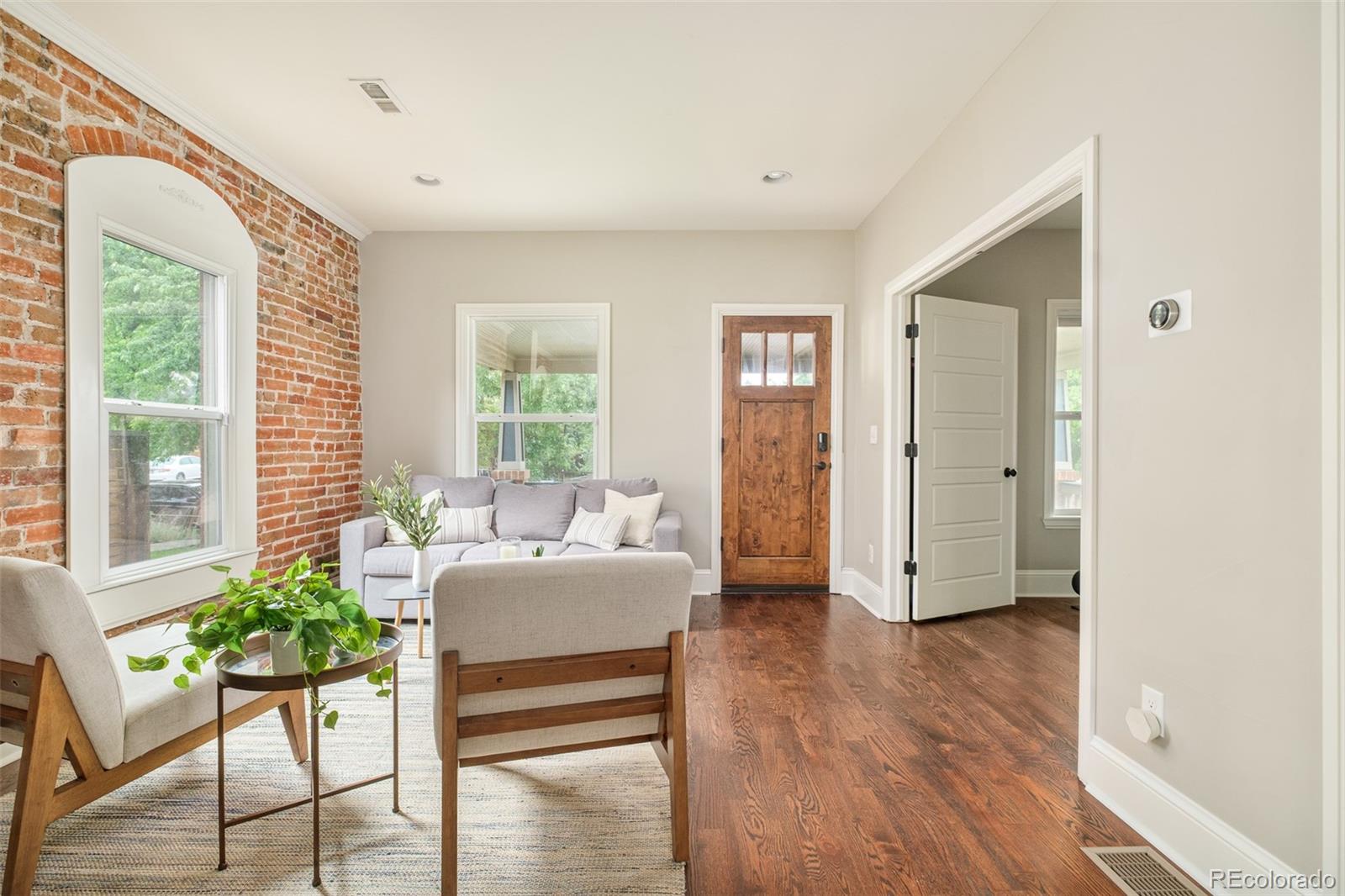 3864 Osceola Street Denver, CO 80212 - Photo 6 of 43 a living room with furniture and a large window