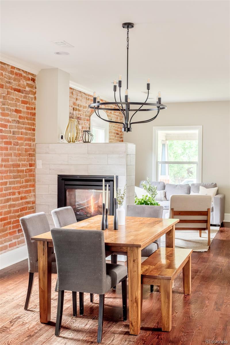 3864 Osceola Street Denver, CO 80212 - Photo 9 of 43 a view of a dining room with furniture window and wooden floor