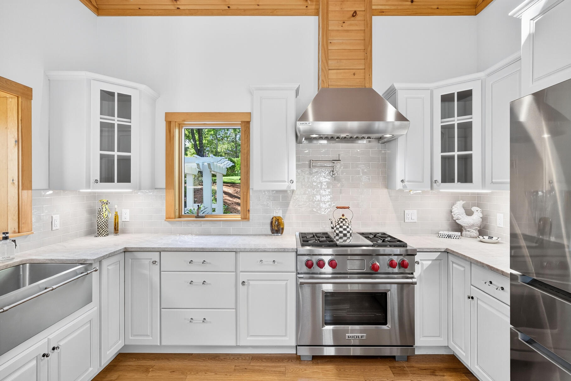 131 Timberlane Drive Mashpee, MA 02649 - Photo 21 of 57 a kitchen with stainless steel appliances a stove a sink and a microwave