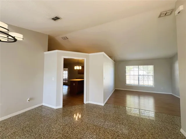 a view of an empty room with a window