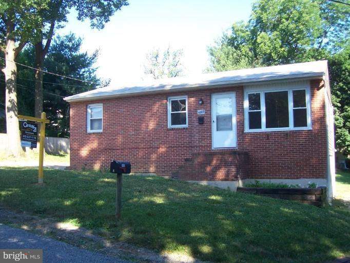5808 Meridale Road Catonsville, MD 21228 - Photo 1 of 9 a front view of a house with garden