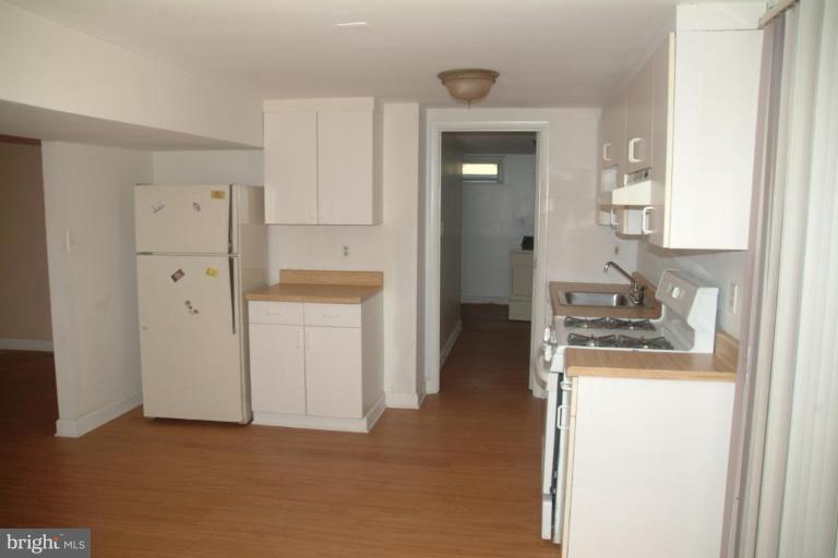 5808 Meridale Road Catonsville, MD 21228 - Photo 2 of 9 a view of a kitchen from the hallway